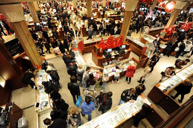 People crowd the aisles inside Macy's de 