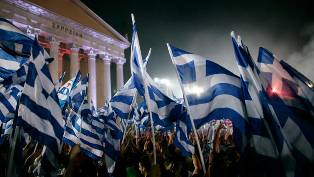 Supporters wave flags on May 3, 2012, as Greek New Democracy leader Antonis Samaras addresses a pre-election rally in Athens, Greece. 