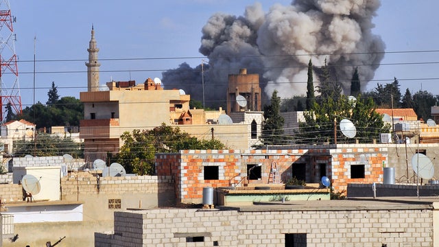 A picture taken from the adjacent Turkish border town of Ceylanpinar shows smoke after a Syrian aircraft bombed the strategic border town of Ras al-Ain, on November 13, 2012. 