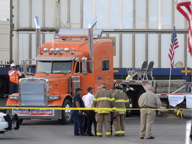 Midland police, fire and sheriffs respond to an accident where a trailer carrying wounded veterans in a parade was struck by a train in Midland, Texas, Thursday, Nov. 15, 2012. "Show of Support" president and founder Terry Johnson tells the Midland Report 