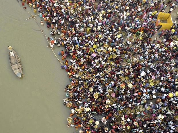 Hindu devotees take part in worship on the banks of the River Ganges river during Chhath festival, an ancient Hindu festival, rituals are performed to thank the Sun God for sustaining life on earth, in Patna, India, Monday, Nov. 19, 2012. 