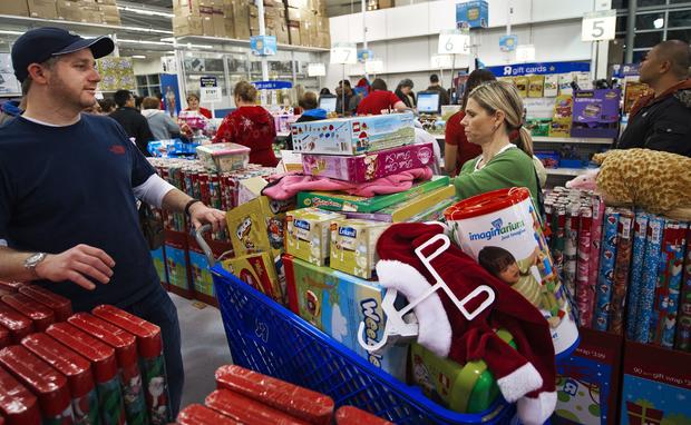 Black Friday shoppers wait in the check-out line 