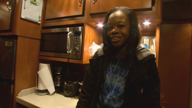 Douglas' favorite spot on the bus is sitting on the counter 