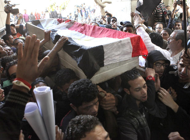 Egyptians carry the body of Gaber Salah, who was who was killed in clashes with security forces, inside a mosque for funeral prayers in Cairo, Egypt, Monday, Nov. 26, 2012. 