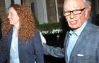 News International chief executive Rebekah Brooks and News Corp. chairman Rupert Murdoch are seen outside his central London residence July 10, 2011. 
