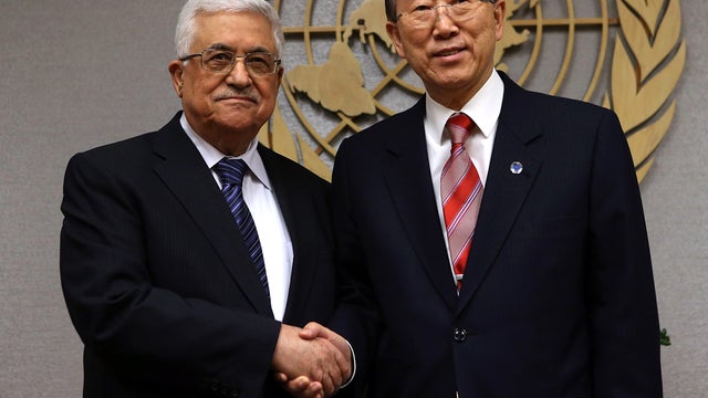 Palestinian President Mahmoud Abbas and U.N. Secretary-General Ban Ki-moon pose for photos at the United Nations Nov. 28, 2012, in New York City. 