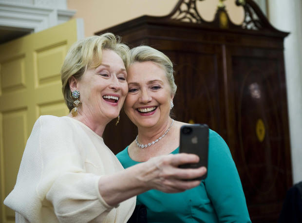 Actress Meryl Streep uses her iPhone to get a photo of her and Secretary of State Hillary Rodham Clinton following the State Department Dinner for the Kennedy Center Honors gala Saturday, Dec. 1, 2012 at the State Department in Washington. 