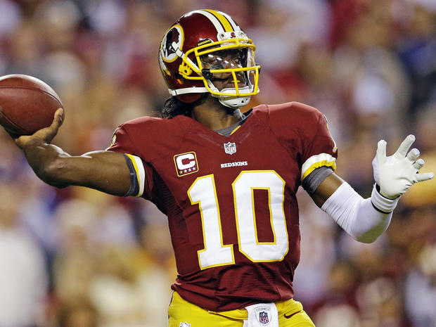 Washington Redskins quarterback Robert Griffin III passes the ball during the first half of an NFL football game against the New York Giants in Landover, Md., Monday, Dec. 3, 2012. 