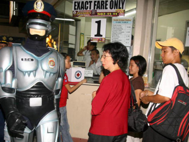 A policeman in a Robocop outfit patrols 