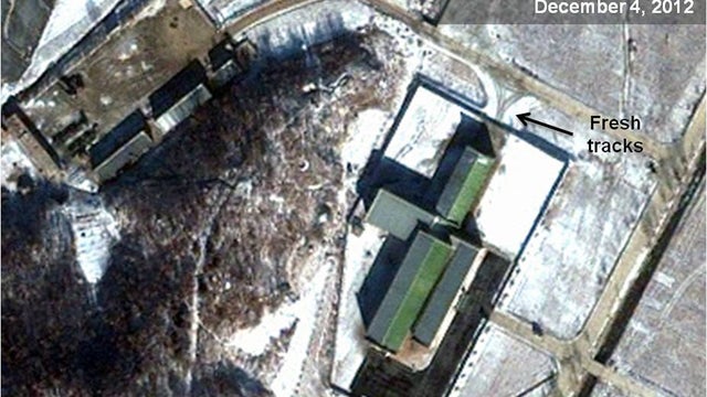 Dec. 4, 2012 satellite image taken by GeoEye and annotated and distributed by NorthKoreaTech and 38 North shows snow covering Sohae launching station in Tongchang-ri, North Korea, including the path where trailers would be used to move rocket stages from  