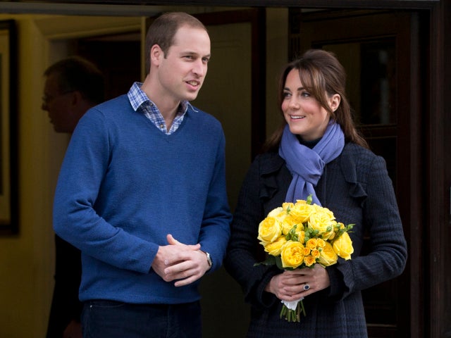 Britain's Prince William stands next to his wife Kate, Duchess of Cambridge as she leaves the King Edward VII hospital in central London, Thursday, Dec. 6, 2012. Prince William and his wife Kate are expecting their first child, and the Duchess of Cambridg 
