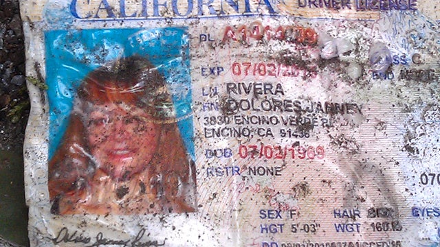 Jenni Rivera's driving license is seen of the ground at the crash site where a plane allegedly carrying Rivera crashed near Iturbide, Mexico Sunday Dec. 12, 2012. The wreckage of a the small plane believed to be carrying Jenni Rivera, the U.S-born singer  