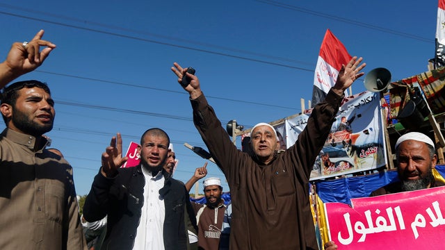 Islamist protesters supporting Egyptian President Mohammed Morsi chant slogans 