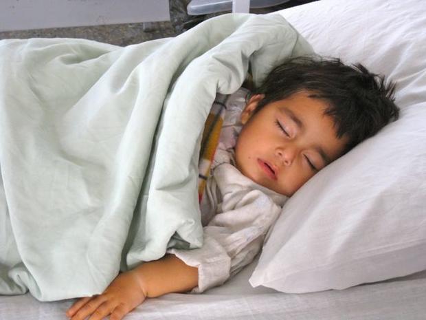 A child rests at Emergency hospital, and donation-based trauma center in Kabul. 