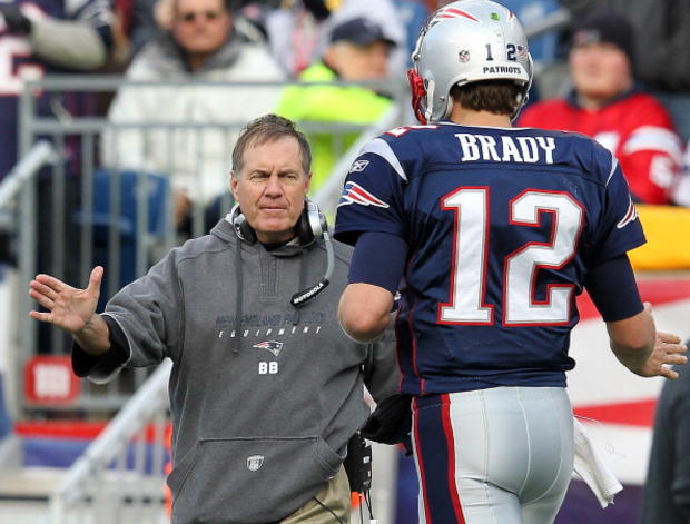 Head coach Bill Belichick and quarterback Tom Brady #12 of the New England Patriots 
