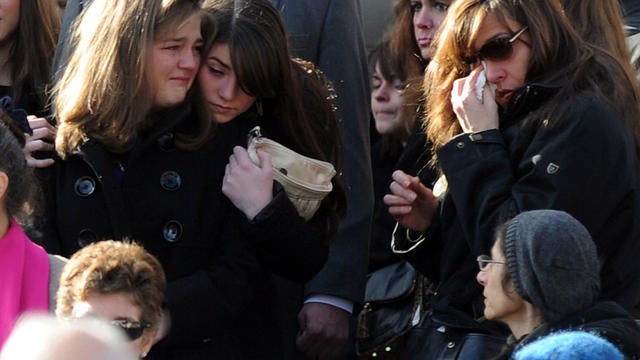 Mourners exit St. Mary of the Assumption Church in Katonah, N.Y., after the funeral for Anne Marie Murphy Dec. 20, 2012. 