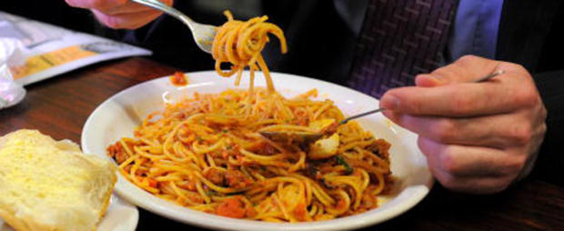 A diner twirls his spaghetti at Pellegri 