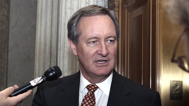 Sen. Michael Crapo talks to reporters in 2007. 