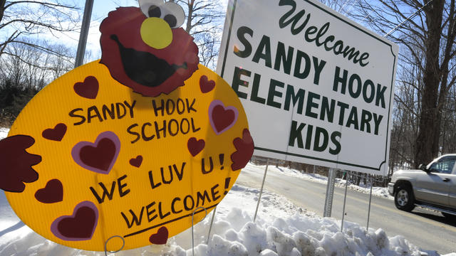 A sign welcomes Sandy Hook Elementary schoolchildren on their first day of classes near the former Chalk School in Monroe, Conn., Jan. 3, 2013. 