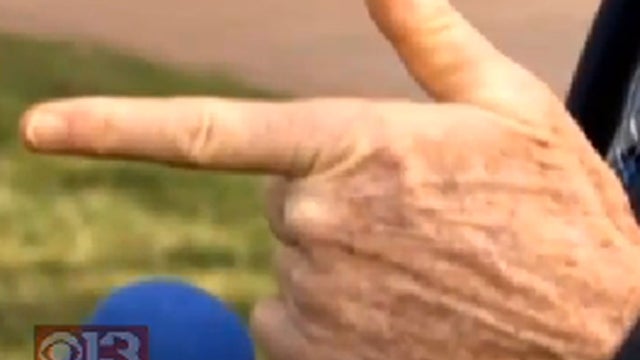gun-gesture---cbs-baltimore.jpg 