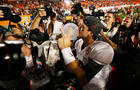 AJ McCarron, of Alabama, celebrates with Coach's Trophy after Crimson Tide beat Notre Dame, 42-14, to win BCS title in Sun Life Stadium in Miami Gardens, Fla.on January 7, 2013  