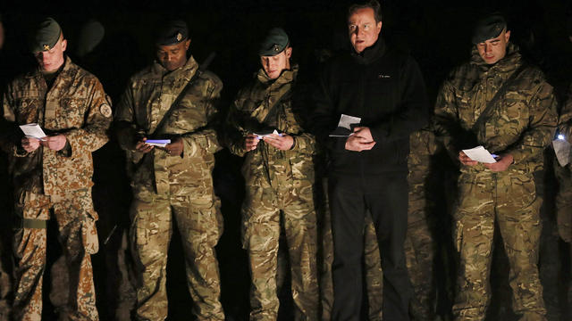 U.K. Prime Minister David Cameron attends a carol service with soldiers during a visit to Forward Operating Base Price in Helmand Province 