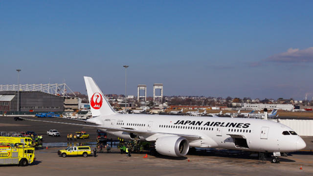 Emergency vehicles respond to a Boeing 787 Dreamliner on Jan. 7, 2013, after smoke from a small electrical fire filled the jet's cabin at Logan International Airport in Boston. 