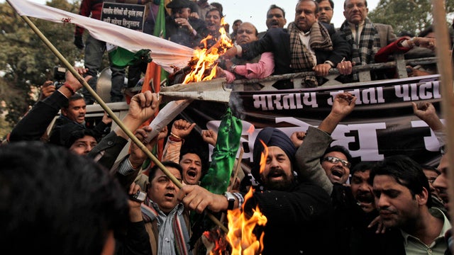 Supporters of India's main opposition Bharatiya Janta Party (BJP) set a Pakistani flag on fire  
