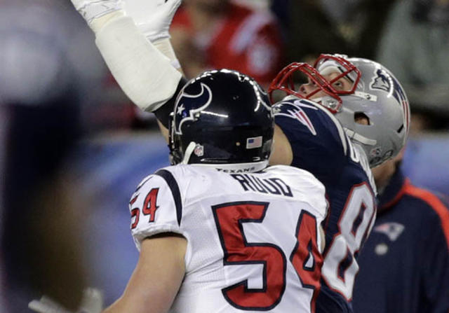 New England Patriots wide receiver Brandon Lloyd (85) celebrates his  touchdown pass with tight end Aaron Hernandez (81) during the first quarter  of an NFL football game against the Houston Texans in