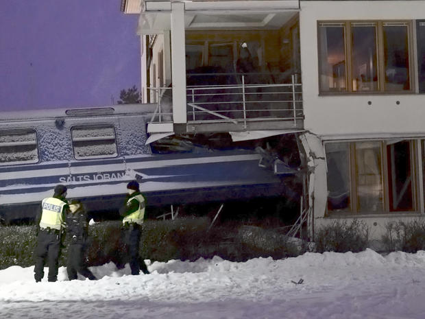 Policemen in front of derailed train in Sweden 