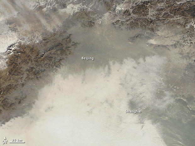 An image taken by NASA's Terra satellite on January 14 shows Beijing and the surrounding area smothered by a layer of extreme air pollution. 