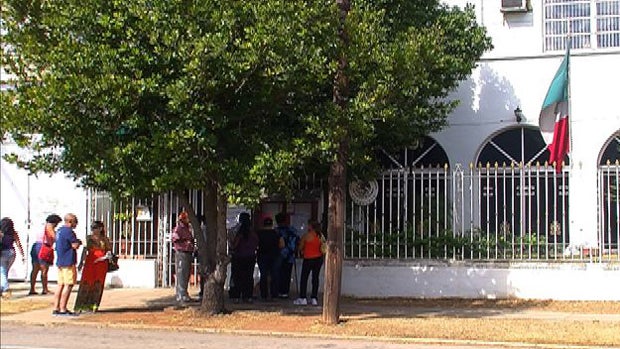 Cubans line up outside the Mexican Embassy in Havana. 