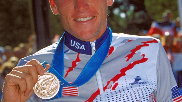 Lance Armstrong celebrates his bronze medal in the men's road cycling individual time trial at the Sydney Olympic Games Sept. 30, 2000. 