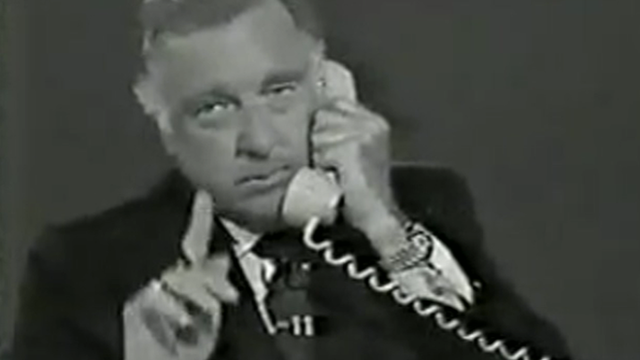 CBS News' Walter Cronkite speaks on the phone with Lyndon B. Johnson's press secretary on January 22, 1973. 