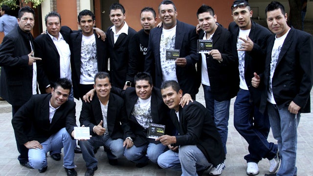 In this Nov. 15, 2011 photo, members of the Colombian style music band Kombo Kolombia pose for the press during a promotional event in Monterrey, Mexico. Sixteen members of the band Kombo Kolombia and four crew members were kidnapped on Friday, Jan. 25, 2 
