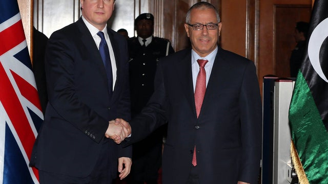 Libyan prime minister Ali Zaidan greets British Prime Minister David Cameron 