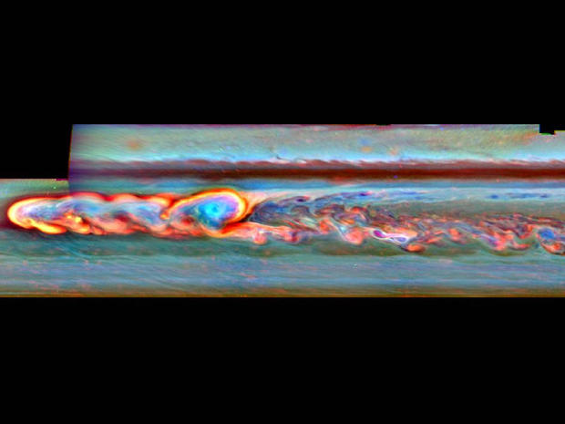 This mosaic of false-color images from NASA's Cassini spacecraft shows what a giant storm in Saturn's northern hemisphere looked like about a month after it began. The bright head of the storm is on the left. The storm also spawned a clockwise-spinning vortex, seen as the light blue circular feature framed with a curl of bright clouds a little to the right of the storm head.  Cassini's imaging camera obtained the images that went into this mosaic on Jan. 11, 2011. The storm erupted in early December 2010 and the head of the storm began moving rapidly westward. The vortex, spun off from the head of the storm in early December shortly after the storm began, drifted much more slowly. In August 2011, the head ran into the vortex, like a version of the mythical serpent that bites its own tail. By late August, the convective phase of the storm was over. 