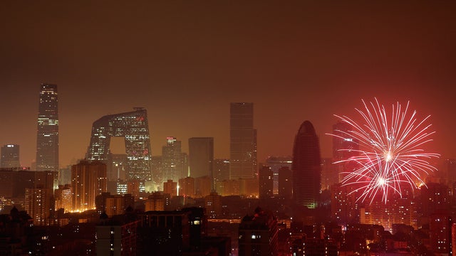 Fireworks illuminate the skyline to celebrate Chinese Lunar New Year of Snake and cause severe air pollution on February 9, 2013 in Beijing, China.  