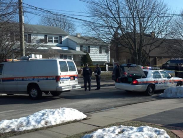 Emergency vehicles at the Massapequa home where a woman's body was discovered 