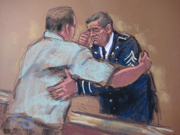 Sgt. Brent Burke hugs a family member after his sentencing 