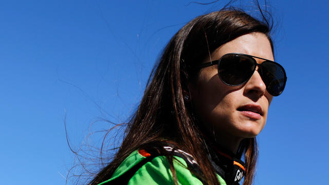 Danica Patrick, driver of the #7 GoDaddy.com Chevrolet, stands on the grid during qualifying for the NASCAR Nationwide Series Ford EcoBoost 300 at Homestead-Miami Speedway on November 17, 2012 in Homestead, Florida. 