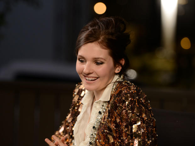 Actress Abigail Breslin sits down for her interview as she waits to be photographed. 