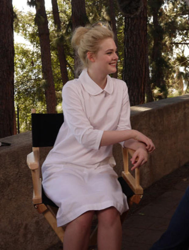 Actress Elle Fanning is interviewed after posing with her sister, Dakota, for the 2013 Vanity Fair Hollywood Portfolio.   