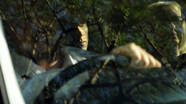 South African Olympic sprinter Oscar Pistorius, center, is seen as he leaves Pretoria Magistrate's Court in Pretoria, South Africa, Feb. 22, 2013, after being freed on bail. 