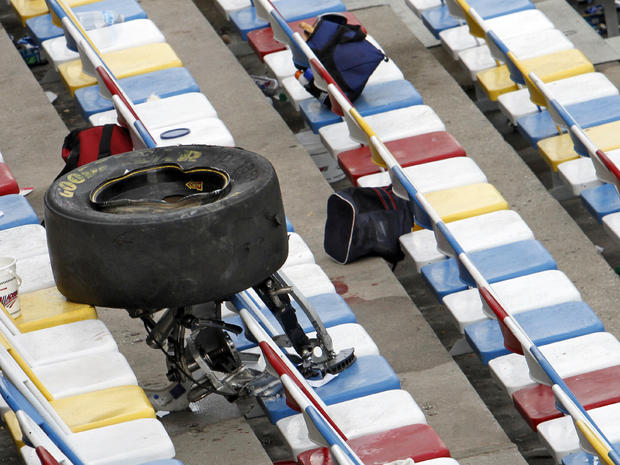 A wheel, tire and suspension parts sit in the stands after a crash on the final lap of the NASCAR Nationwide Series auto race Feb. 23, 2013, at Daytona International Speedway in Daytona Beach, Fla. 