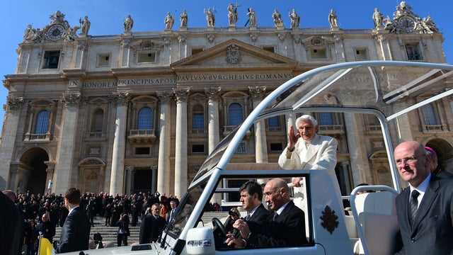 Pope Benedict XVI waves as he leaves in his papamobile at the end of his last weekly audience on February 27, 2013 at St Peter's square at the Vatican. 