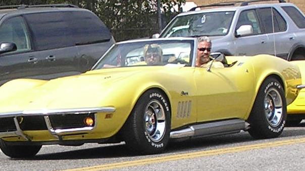 Joe and Tina Caronna driving their 1969 yellow Corvette for a 2008 fundraiser just a few months before Tina's murder. 
