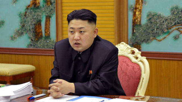 undated file photo released by the Korean Central News Agency and distributed Sunday, Jan. 27, 2013 in Tokyo by the Korea News Service, North Korean leader Kim Jong Un attends a consultative meeting with officials in the fields of state security and forei 