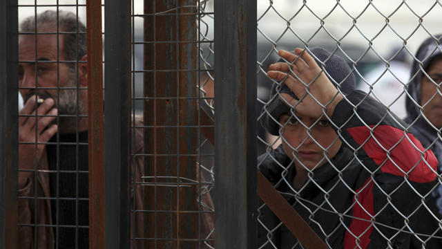 Newly arrived Syrian refugees wait for their turn to receive mattress, blankets and other supplies, and to be assigned to tents, at Zaatari Syrian refugees camp in Mafraq, near the Syrian border with Jordan, in January 2013 file photo 