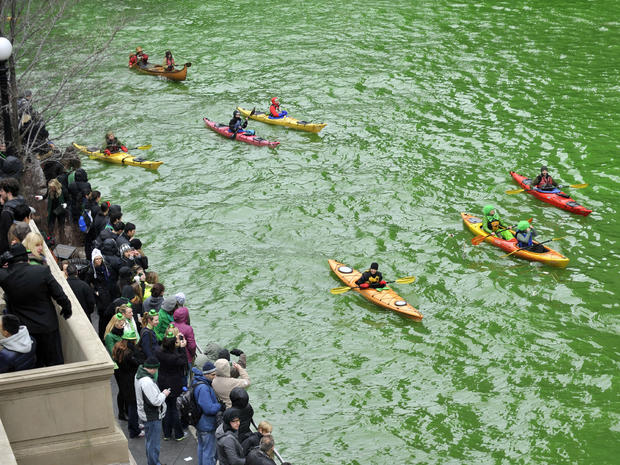 Spectators watch as the Chicago River is dyed green right before the start of the St. Patrick's Day parade in Chicago March 16, 2013. With the holiday itself falling on a Sunday, many celebrations were scheduled instead for Saturday because of religious o 
